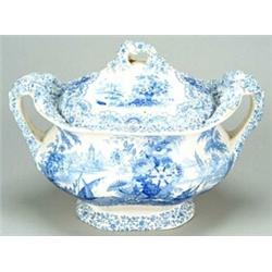 A blue-printed soup tureen and cover, of bulbous form with ornate leafy-branch moulded handles an...