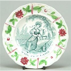 A child's plate "The Pet Lamb", the rim moulded with flowers and leaves enamelled in green and cr...