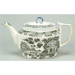 An early 19th century black-printed pearlware teapot and cover, of oval shape with "D" handle and...