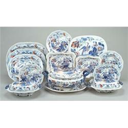 An "Improv'd Canton China" part dinner service, with gadrooned edges and gilt blue scroll-moulded...