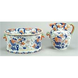 A Mason's Patent Ironstone China footbath and matching jug, outline printed in blue and brightly...