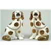 Image 1 : A pair of models of spaniels, facing left and right seated on their haunches, painted with with c...