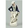 Image 1 : A figure of a sailor, modelled standing leaning on an anchor, partially coloured and gilt, 18cm h...
