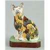 Image 1 : A pearlware model of a cat, possibly Scottish, modelled seated on its haunches, painted with colo...