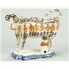 Image 1 : A pearlware cow creamer, modelled standing on on a stepped and shaped rectangular base with cante...