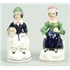 Image 1 : A pair of porcelaineous figures of Queen Victoria and another figure, probably the Prince of Wale...