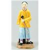 Image 1 : A Royal Worcester figure of 'Chink' modelled by James Hadley, the Chinaman modelled standing hold...