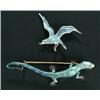 Image 1 : A Continental brooch in the form of a lizard in an alert pose and enamelled in varying shades of...