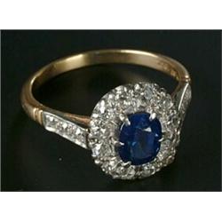 A sapphire and diamond oval cluster ring, centred with an oval mixed-cut sapphire, approx. 1.36ct...