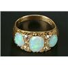 A late Victorian gold, opal and diamond carved half-hoop ring, the three oval white opals with ol...