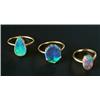 Image 1 : Three black opal single stone rings, comprising; an Edwardian gold and oval millegrain set ring d...