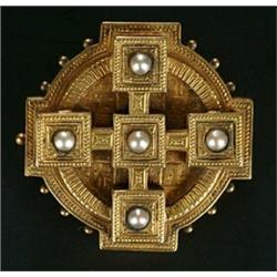 A Victorian gold and half-pearl locket-back brooch, the shaped-round and engraved panel with a be...