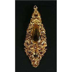 A 19th century gold and citrine cannetille drop-shaped pendant, centred with a pear-shaped citrin...