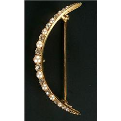 A late Victorian gold, pearl and diamond open crescent brooch, alternately set with graduated old...