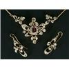 Image 1 : An Edwardian garnet and diamond necklace, with a central garnet and old-cut diamond cluster withi...