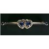 Image 1 : An early 20th century sapphire and diamond twin hearts bar brooch, each heart centred with a roun...