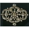 Image 1 : A Victorian diamond brooch, in the form of an oval lobed openwork panel centred with a cluster an...