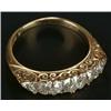 An early 20th century gold and diamond five stone carved half hoop ring, with rose diamond points...