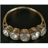 Image 1 : A diamond five stone ring, the old-cut stones approx. 1.25cts total, rub-over set in white and ye...