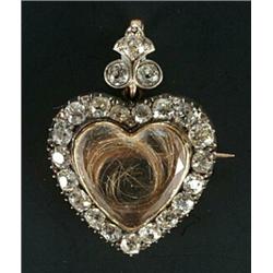 A late Victorian diamond heart shaped pendant, centred with a hair glazed panel within and old-cu...