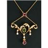 Image 1 : An Edwardian gold, half-pearl, peridot and pink tourmaline necklace, of openwork scroll design wi...