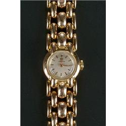 Omega, a lady's Swiss 14ct rose gold round bracelet watch, circa 1960. no.10789826, silvered dial...