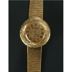 Bueche Girod, a lady's 18ct gold round bracelet watch, circa 1970, no.106636, round textured dial...