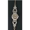 Image 1 : A lady's Swiss platinum and diamond round wristwatch, circa 1935, silvered dial with black Arabic...