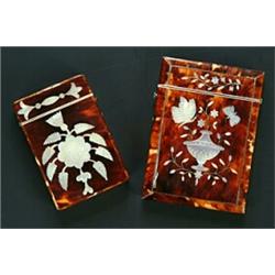 Two tortoiseshell and mother of pearl card cases, one inlaid with and urn, butterflies, trailing...