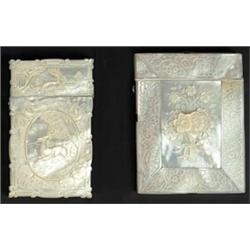 Two carved mother of pearl card cases, one carved with a leaping stag within an oval panel surrou...