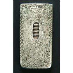 A silver small oblong card case with a flat hinged end-cover and a serrated thumb-piece, engraved...