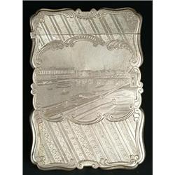 A Victorian silver card case of shaped outline, the front engraved with a view of Somerset House...