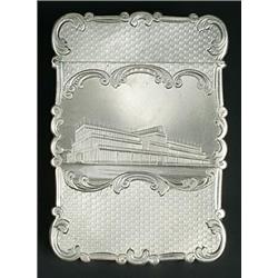 A Victorian silver card case of shaped outline, the front engraved with a view of the Crystal Pal...