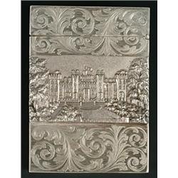 A Victorian silver 'castle top' card case, the front chased with a view of Windsor Castle between...