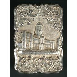 A Victorian silver 'castle top' card case of shaped outline, chased with a view of Christchurch,...