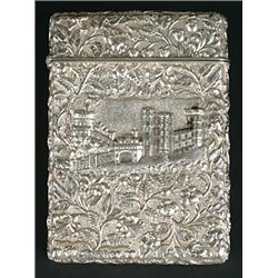 A Victorian silver double-sided 'castle top' card case, the front chased with a view of St George...