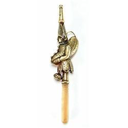 A 19th century Continental silver gilt rattle in the form of Pulchinello with a whistle and a mot...