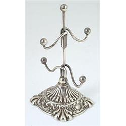 A ring tree on fluted and embossed shaped-square base, Birmingham 1904 by Hilliard and Thomason,...