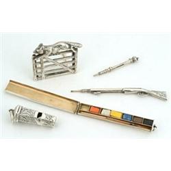 A collection of miniature silver, comprising; a propelling pencil in the form of a musket with fo...