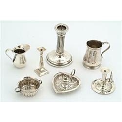 A collection of miniature silver, comprising; two part fluted porringers, London 1822 by William...