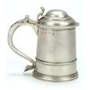 Image 1 : A George I small tankard with a mounded girdle and borders, domed cover with scroll thumb-piece a...