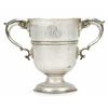 Image 1 : A George III Irish campana shaped cup with two leaf capped double scroll handles, a moulded girdl...