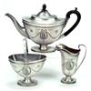 Image 1 : A three piece oval tea service, each with a moulded rim and oval reeded pedestal foot, applied wi...