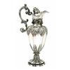 Image 1 : An early Victorian claret jug, with a fluted vase shaped body and shaped round foot chased with a...