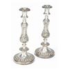Image 1 : A pair of round candlesticks with vase shaped capitals, the baluster and knopped stems and bases...