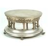 Image 1 : A round two tier cake stand with a reed and ribbon border, a chased band of cavorting putti, flut...