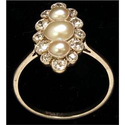 A marquise cluster ring, set with split pearls and old cut diamonds, stamped PLAT. See Illustrati...