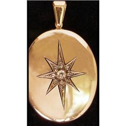 A Victorian oval locket, star set with old and rose cut diamonds, acid tested gold. See Illustrat...