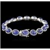 Image 2 : PLATED SILVER 28.60ctw Tanzanite and Topaz Bracelet