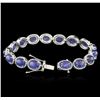 Image 3 : PLATED SILVER 28.60ctw Tanzanite and Topaz Bracelet
